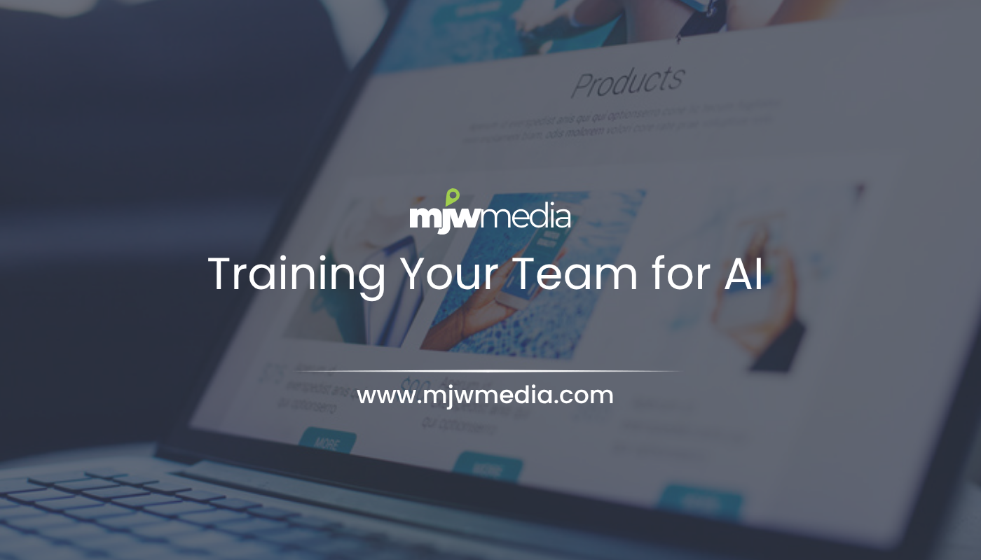 A manager coaching a small business team on training your team to work alongside ai tools, mjw media
