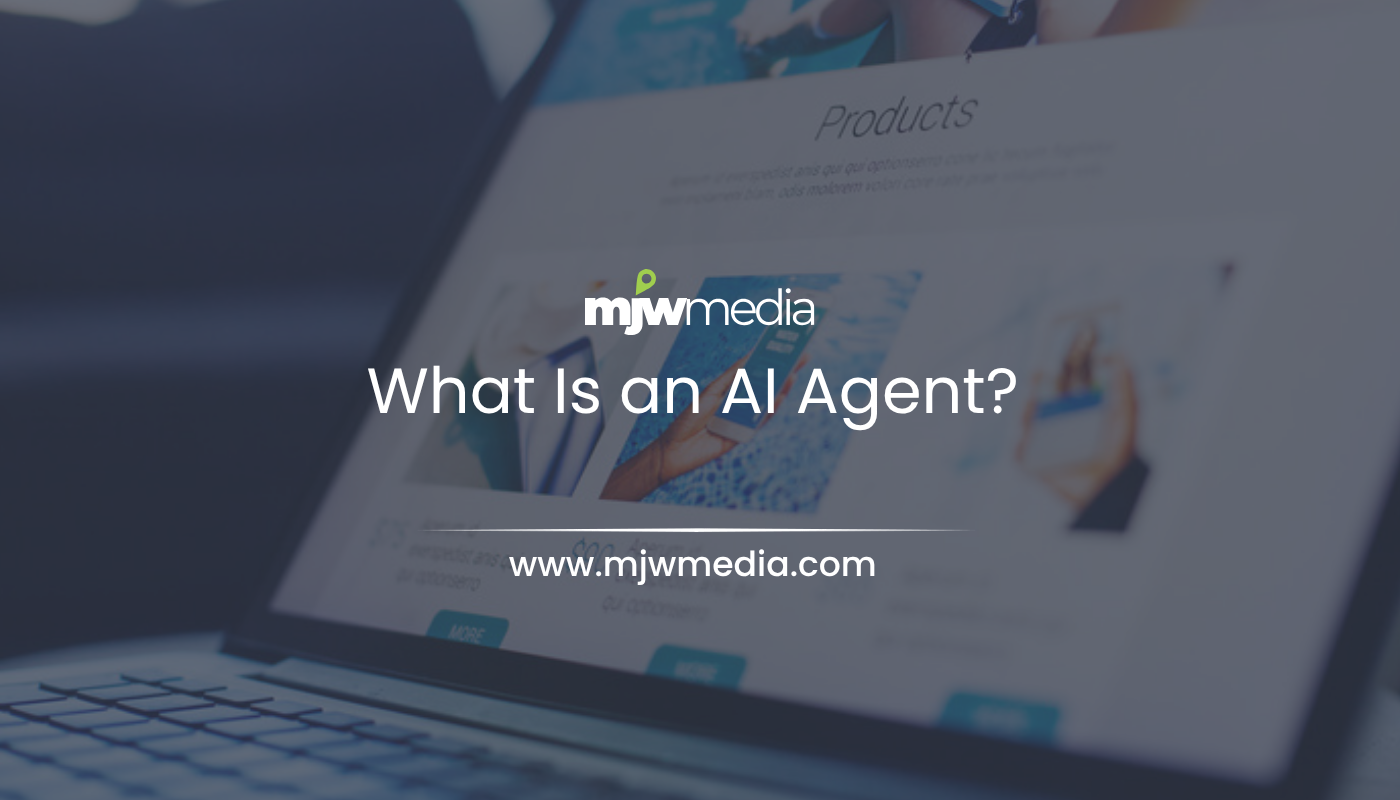 Small-business owner reviewing an ai agent workflow on a laptop, illustrating mjw media's plain-english guide to ai agents